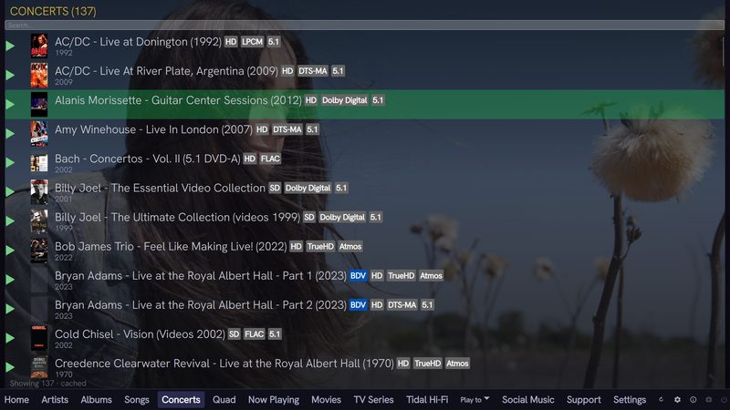 QSYNC Media Player concerts view listing 137 live concert releases with format badges including TrueHD Atmos, DTS-MA, LPCM and Dolby Digital